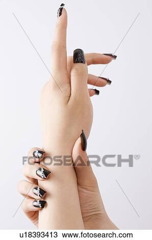 Woman's hand with artificial fingernail View Large Photo Image Stock Image - Woman's hand with artificial fingernail. Fotosearch