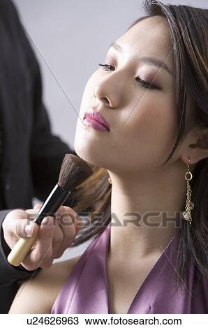 Young woman having her makeup down View Large Photo Image Stock Image - Young woman having her makeup down. Fotosearch
