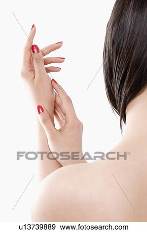 Stock Photo - Young woman overlapping her hands. Fotosearch