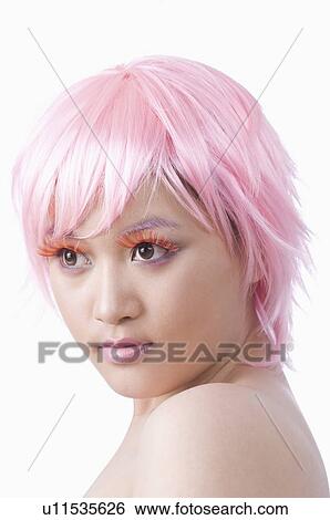 Young woman wearing pink wig and pink make-up View Large Photo Image Stock Photograph - Young woman wearing pink wig and pink make-up. Fotosearch
