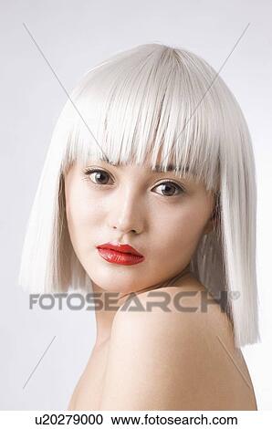 Young woman wearing white wig View Large Photo Image Stock Image - Young woman wearing white wig. Fotosearch