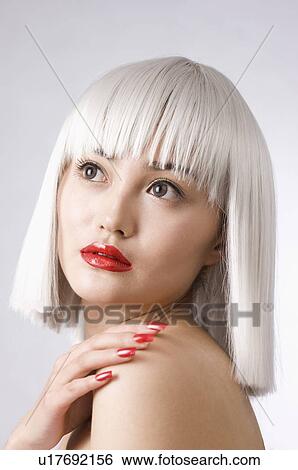 Young woman wearing wig View Large Photo Image Stock Photograph - Young woman wearing wig. Fotosearch