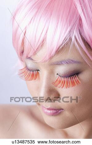 Young women wearing pink wig and false eyelash View Large Photo Image Stock Photography - Young women wearing pink wig and false eyelash. Fotosearch