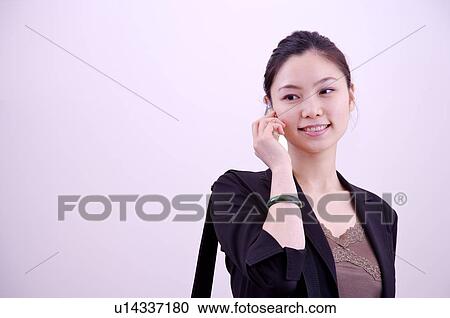 Young woman on the phone, portrait View Large Photo Image Stock Image - Young woman on the phone, portrait. Fotosearch