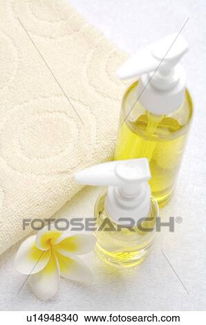 Aromatherapy oil and frangipani beside towel View Large Photo Image Stock Image - Aromatherapy oil and frangipani beside towel. Fotosearch