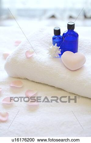 Aromatherapy oil and heart shape on folded towel View Large Photo Image Stock Image - Aromatherapy oil and heart shape on folded towel. Fotosearch