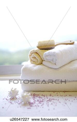 Brush and rolled towel on folded towel View Large Photo Image Stock Photo - Brush and rolled towel on folded towel. Fotosearch