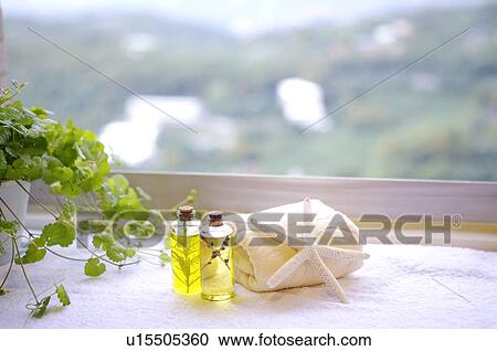 Folded towel, aromatherapy oil and starfish on the towel View Large Photo Image Stock Image - Folded towel, aromatherapy oil and starfish on the towel. Fotosearch