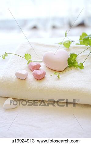 Folded towel with heart shapes on top View Large Photo Image Stock Image - Folded towel with heart shapes on top. Fotosearch