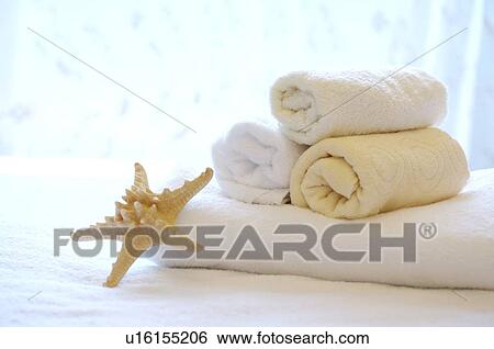 Rolled towel and starfish on folded towel View Large Photo Image Stock Photograph - Rolled towel and starfish on folded towel. Fotosearch