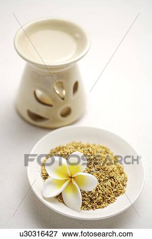 Stock Photo - Spa treatment and aromatherapy burner on the table. Fotosearch