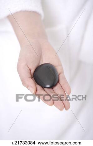Stone in woman's hand View Large Photo Image Picture - Stone in woman's hand. Fotosearch