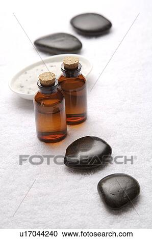 Stones, bath salt and aromatherapy oil on towel View Large Photo Image Stock Image - Stones, bath salt and aromatherapy oil on towel. Fotosearch