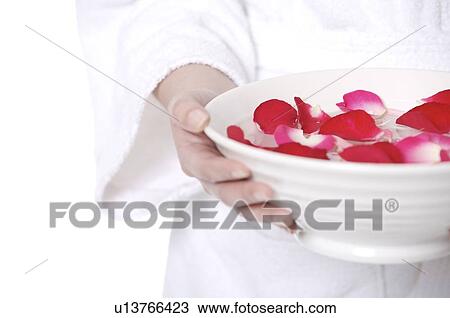 Woman carrying bowl of water with rose petals View Large Photo Image Stock Image - Woman carrying bowl of water with rose petals. Fotosearch