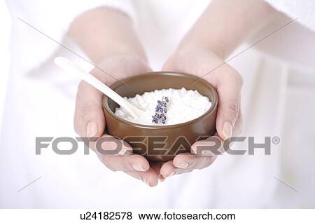 Woman holding a bowl of salt in her cupped hands View Large Photo Image Stock Photo - Woman holding a bowl of salt in her cupped hands. Fotosearch