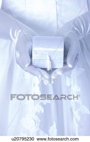 Bride cupping a box View Large Photo Image Stock Image - Bride cupping a box. Fotosearch