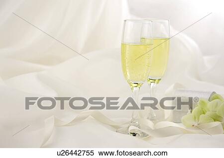 Champagne and flowers on wedding dress View Large Photo Image Stock Photography - Champagne and flowers on wedding dress. Fotosearch