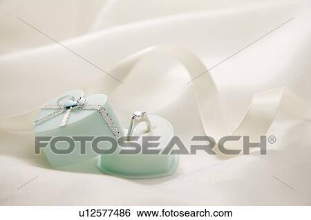 Stock Photograph - Engagement ring in box. Fotosearch