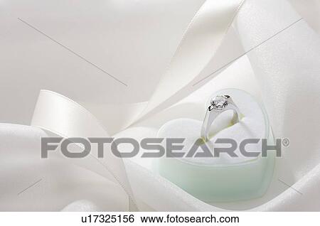 Stock Photograph - Engagement ring in jewelry box. Fotosearch