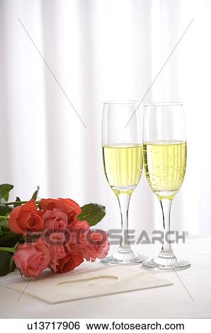 Prink roses and champagne View Large Photo Image Stock Photograph - Prink roses and champagne. Fotosearch