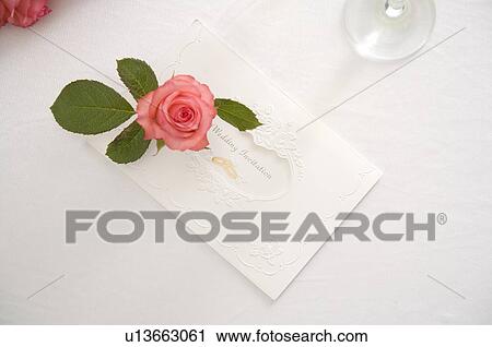 Single rose and wedding invitation on table View Large Photo Image Stock Image - Single rose and wedding invitation on table. Fotosearch