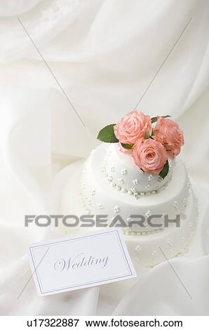 Wedding cake and wedding name card View Large Photo Image Stock Photo - Wedding cake and wedding name card. Fotosearch