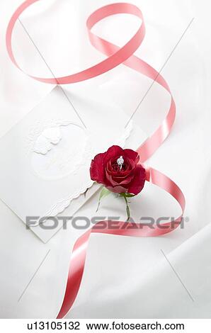 Wedding invitation and red ribbon on fabric View Large Photo Image Stock Image - Wedding invitation and red ribbon on fabric. Fotosearch