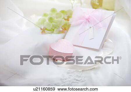 Wedding invitation, jewelry box on fabric View Large Photo Image Stock Photo - Wedding invitation, jewelry box on fabric. Fotosearch