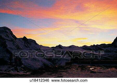 Stock Photograph - Lake, Ice, Pond, Switzerland, Wild field, Mountain, Nature landscape. Fotosearch