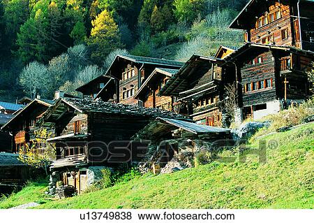 Stock Photo - Switzerland, Houses, Mountains, Valley, Plants, Tree, Plant. Fotosearch