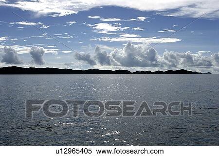 Ocean, cloud, glistening light of waves, mountain range, Asia, mountain, sky View Large Photo Image Stock Photography - Ocean, cloud, glistening light of waves, mountain range, Asia, mountain, sky. Fotosearch