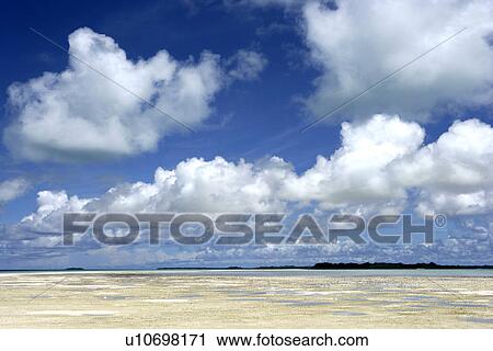 Stock Image - sunny, daytime, quiet, white cloud, beach, sky. Fotosearch