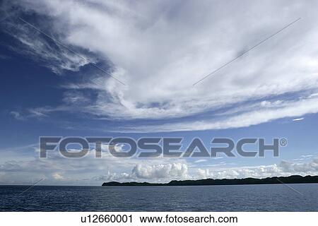 Stock Image - wave, Ocean, mountain, sunny day, outdoors, outside. Fotosearch