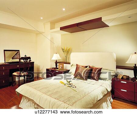 Stock Image - interior decoration, furniture, bedroom, interior art, table, bed, dresser. Fotosearch
