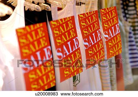 Large 'Sale' signs in front of rows of tank tops View Large Photo Image Stock Image - Large 'Sale' signs in front of rows of tank tops. Fotosearch
