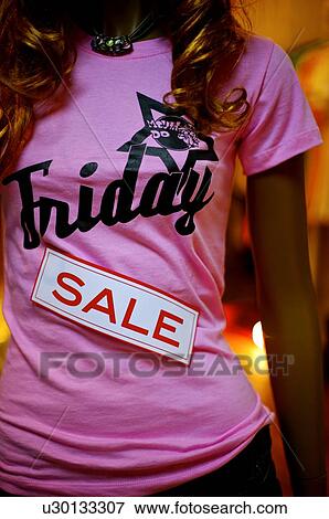 Red and white 'Sale' sign on a pink T-shirt on a female mannequin View Large Photo Image Stock Photo - Red and white 'Sale' sign on a pink T-shirt on a female mannequin. Fotosearch