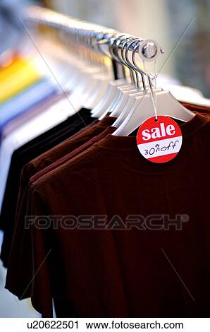 Row of various T-shirts on sale, close-up View Large Photo Image Stock Image - Row of various T-shirts on sale, close-up. Fotosearch