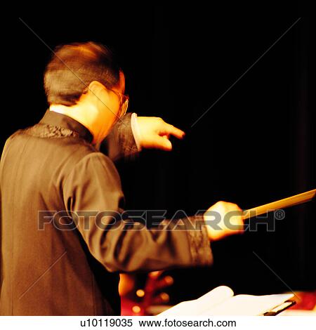 Conducting, performer, Executor, Yellow, Mmusic Stand, Music, Male View Large Photo Image Stock Photography - Conducting, performer, Executor, Yellow, Mmusic Stand, Music, Male. Fotosearch
