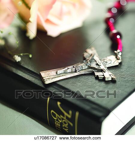 Stock Photo - Belief, Cross, Christianism, Book, Flowers, Plants, Religions. Fotosearch
