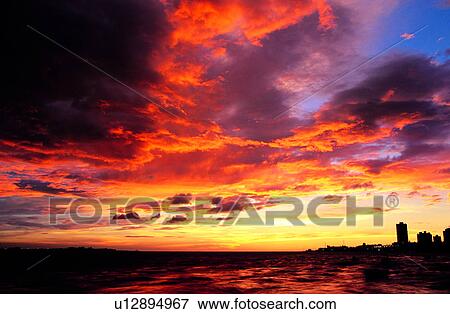 Houses, Seaside, Wave, Clouds, Ocean, Sunset, Sky View Large Photo Image Stock Photo - Houses, Seaside, Wave, Clouds, Ocean, Sunset, Sky. Fotosearch