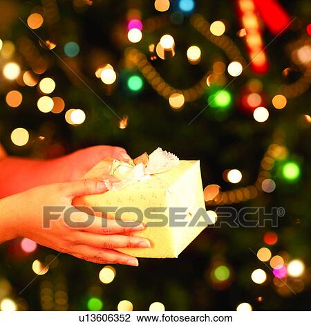 Stock Image - Happy, Amusement, People, Gifts, Christmas Tree, Festival, Tradition. Fotosearch