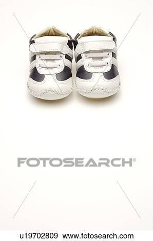 A pair of black and white baby shoes View Large Photo Image Stock Photo - A pair of black and white baby shoes. Fotosearch