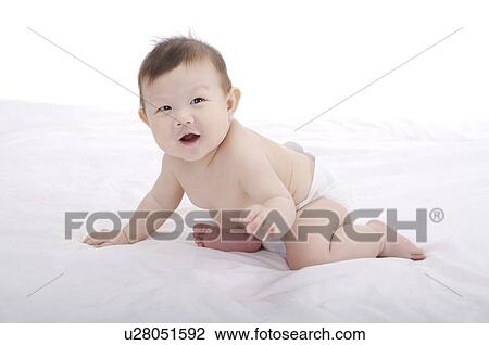 Baby boy wearing a diaper, sitting, laughing View Large Photo Image Stock Image - Baby boy wearing a diaper, sitting, laughing. Fotosearch