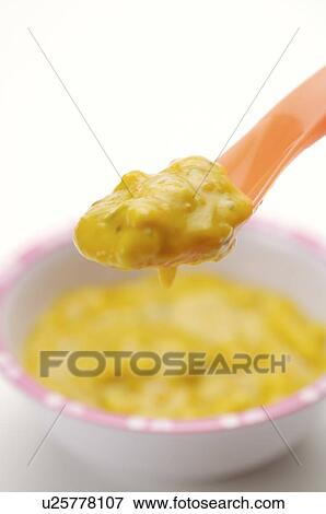 Baby food on a spoon and in a bowl, close-up View Large Photo Image Stock Photo - Baby food on a spoon and in a bowl, close-up. Fotosearch
