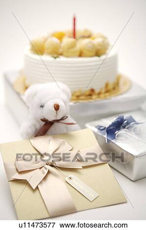 Birthday card, presents, and a cake with a candle View Large Photo Image Stock Photo - Birthday card, presents, and a cake with a candle. Fotosearch