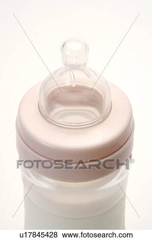 Close-up of a baby bottle, filled with milk View Large Photo Image Stock Photo - Close-up of a baby bottle, filled with milk. Fotosearch