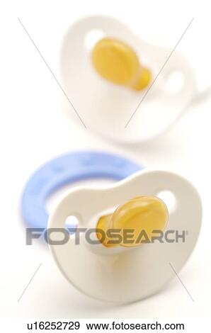 Colorful plastic pacifiers, close-up View Large Photo Image Stock Photo - Colorful plastic pacifiers, close-up. Fotosearch