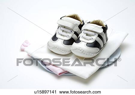 Pair of baby shoes on a pile of neatly folded blankets View Large Photo Image Stock Image - Pair of baby shoes on a pile of neatly folded blankets. Fotosearch