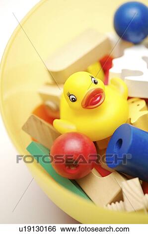 Yellow rubber duck and wooden toy blocks, in a plastic bowl View Large Photo Image Stock Photograph - Yellow rubber duck and wooden toy blocks, in a plastic bowl. Fotosearch