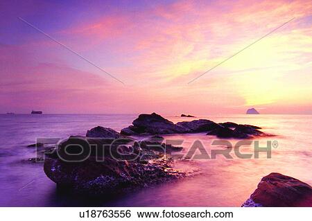 Stock Photograph - Seas, Ocean, Oceans, Taiwan, Formosa, Rocks, Sunset. Fotosearch